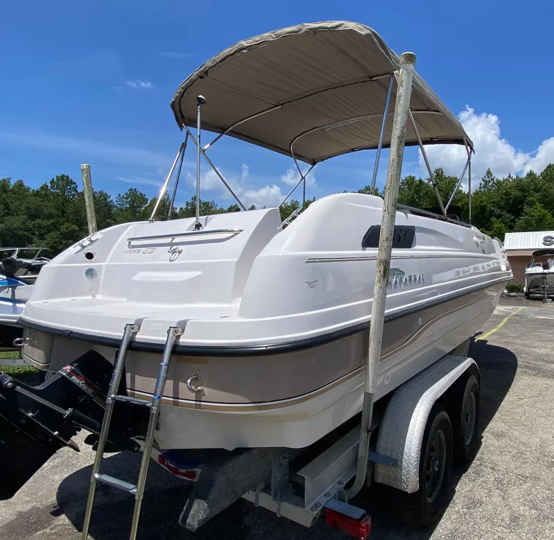 Slide: The Image of 1997 Chaparral 250 Sunseta boat on trailer with canopy, rear view. - 4