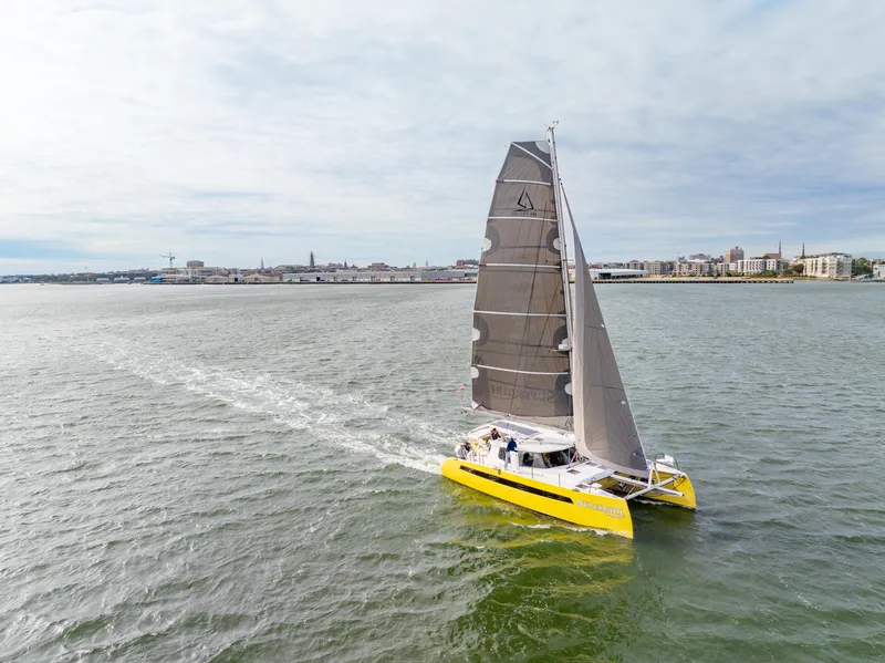 The Image of Yellow Balance 442 catamaran sailing on open water, 2022 model. - 0