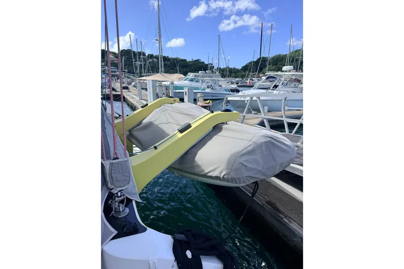 Slide: The Image of Covered boat on Balance 442, 2022 model, docked at marina with clear sky. - 118