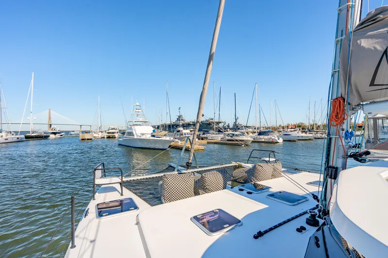 Slide: The Image of View from Balance 442 yacht, 2022 model, in a bustling marina with clear blue skies. - 19