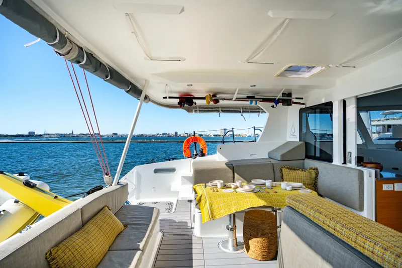 Slide: The Image of Spacious deck of 2022 Balance 442 yacht with ocean view and dining setup. - 25