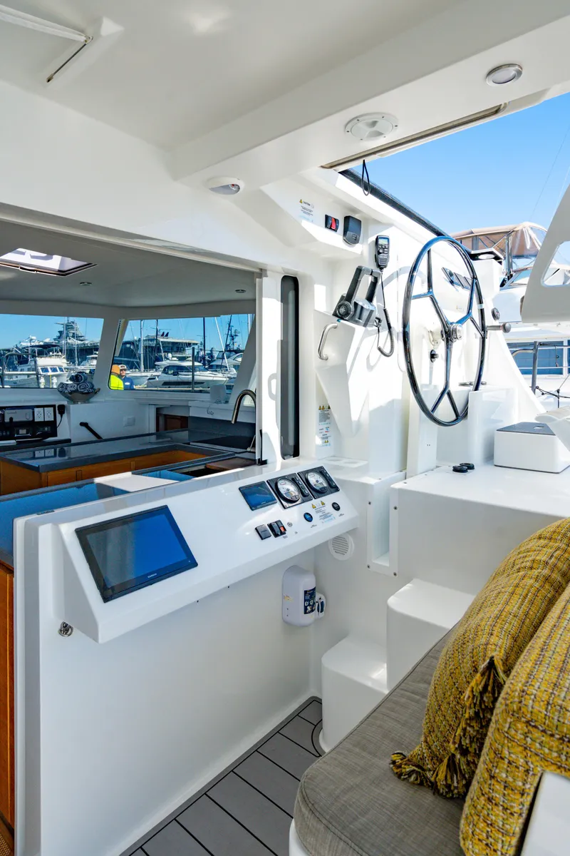 Slide: The Image of Modern Balance 442 yacht cockpit with navigation controls, 2022 model, docked at marina. - 28