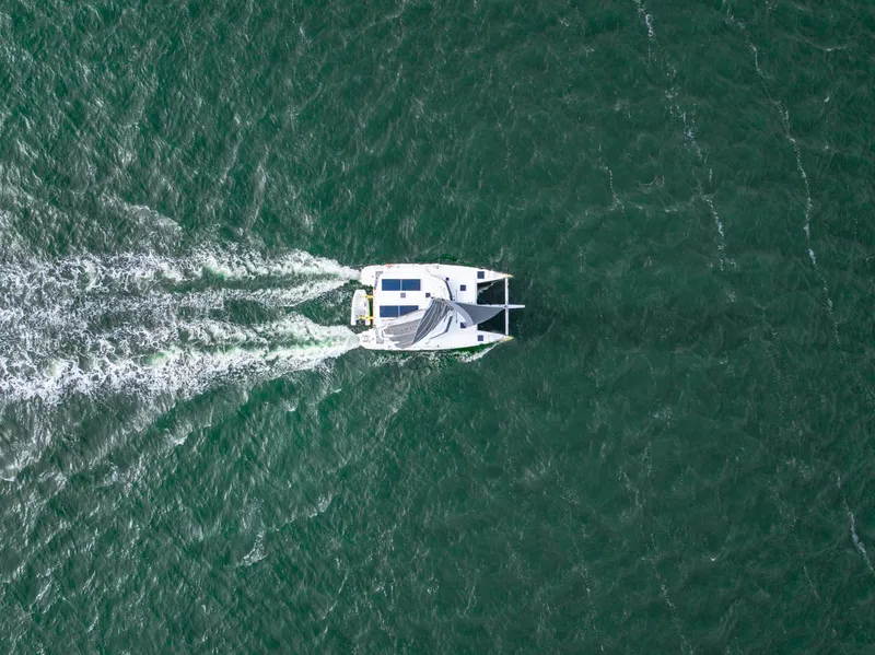 Slide: The Image of Aerial view of 2022 Balance 442 catamaran sailing on open water. - 3