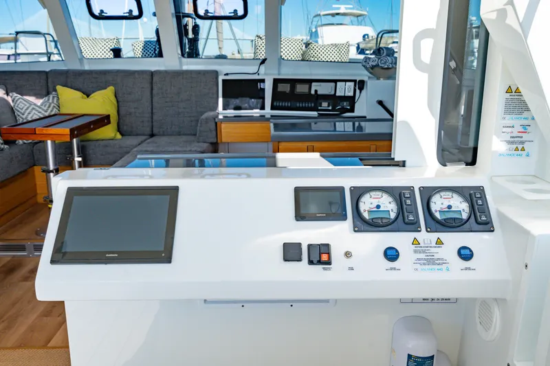Slide: The Image of Modern Balance 442 yacht interior with navigation controls, seating, and wooden accents, 2022 model. - 30