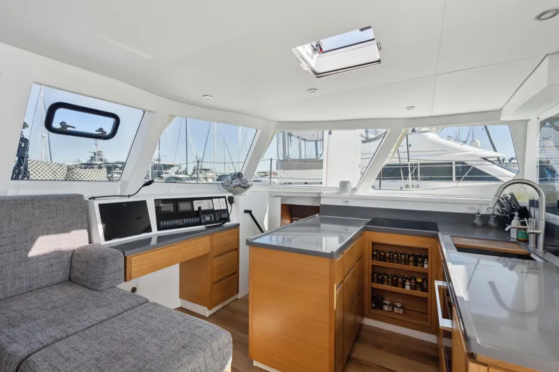 Slide: The Image of Modern Balance 442 yacht interior with sleek kitchen and navigation area, 2022 model. - 35