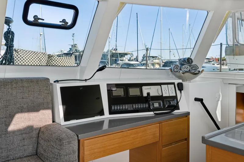 Slide: The Image of Interior of 2022 Balance 442 yacht with modern navigation controls and marina view. - 37