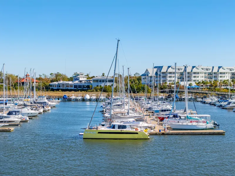 Slide: The Image of Marina with Balance 442 sailboats, 2022 model, docked under clear blue sky. - 4