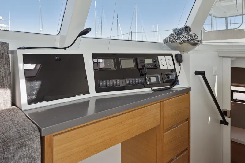 Slide: The Image of Modern Balance 442 yacht cockpit with navigation equipment and wooden cabinetry, 2022 model. - 42