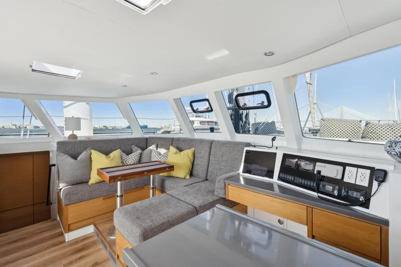 Slide: The Image of Modern yacht interior with gray seating, wooden accents, and navigation equipment, Balance 442, 2022 model. - 43