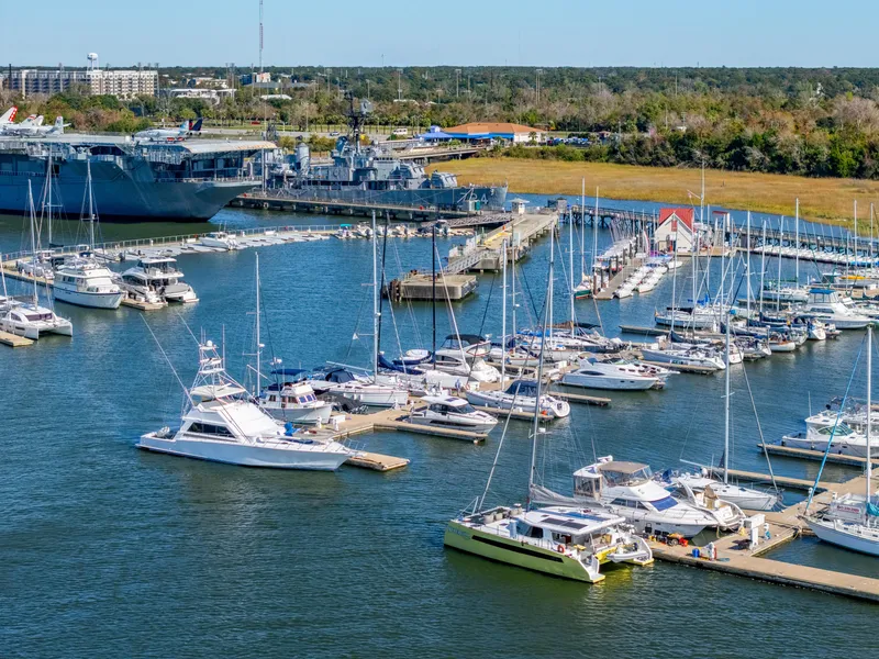 Slide: The Image of Marina with boats and yachts, featuring a Balance 442 model, 2022. - 99