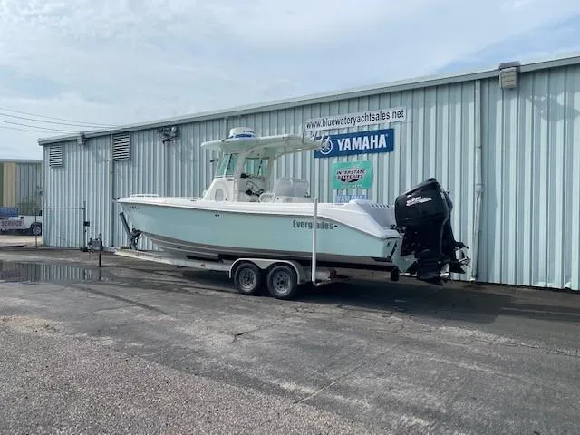Slide: The Image of 2008 Everglades 290 CC boat on trailer outside dealership with Yamaha sign. - 2