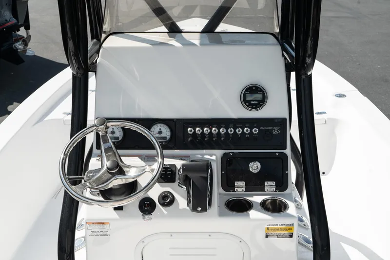 Slide: The Image of 2025 Blazer 2220 Fisherman boat console with steering wheel and control panel. - 17