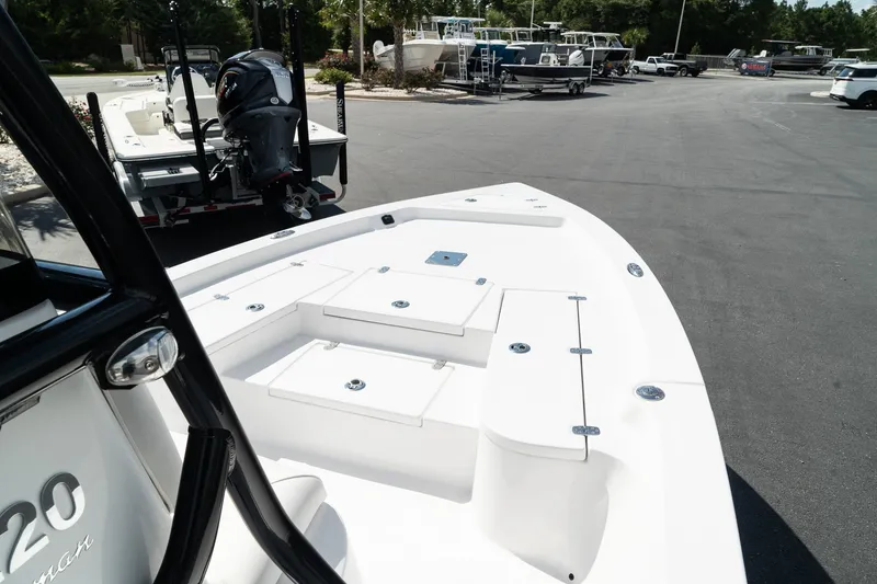 Slide: The Image of 2025 Blazer 2220 Fisherman boat at a marina, showcasing its spacious deck. - 19