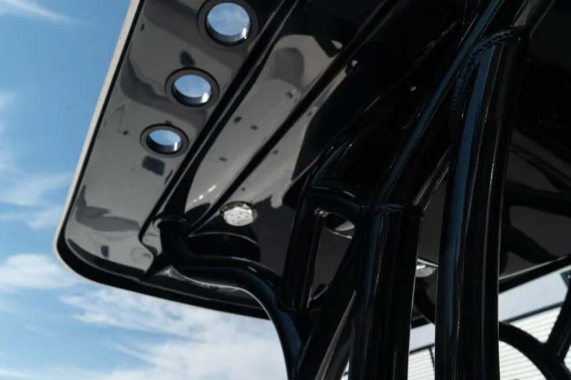 Slide: The Image of Close-up of 2025 Blazer 2220 Fisherman boat's T-top with rod holders. - 23
