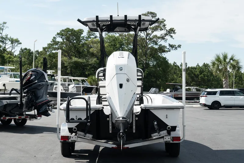 Slide: The Image of 2025 Blazer 2220 Fisherman boat on trailer, rear view in marina. - 3