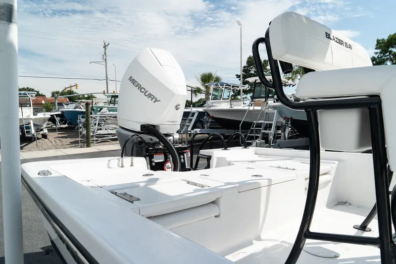 Slide: The Image of 2025 Blazer 2220 Fisherman boat with Mercury engine in a marina. - 9