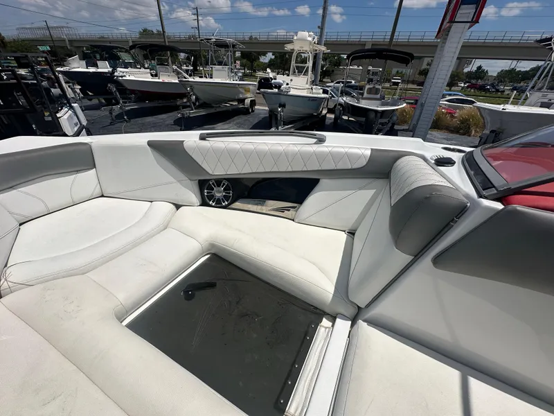 Slide: The Image of Interior of a 2015 Tigé Z3 boat with white seating and storage compartment. - 5