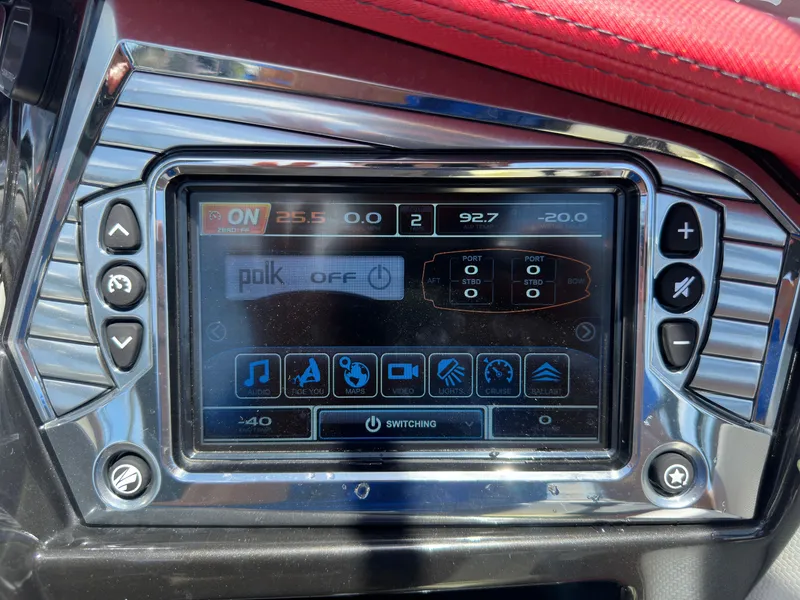 Slide: The Image of 2015 Tigé Z3 boat dashboard touchscreen display with various control options. - 9