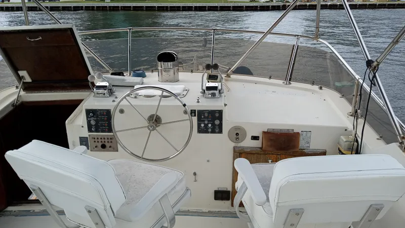 Slide: The Image of Helm of 1986 Hatteras 53 Extended Deckhouse Motor Yacht with dual captain chairs. - 10