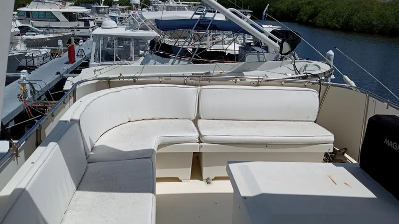 Slide: The Image of 1986 Hatteras 53 Extended Deckhouse Motor Yacht with spacious outdoor seating area. - 13