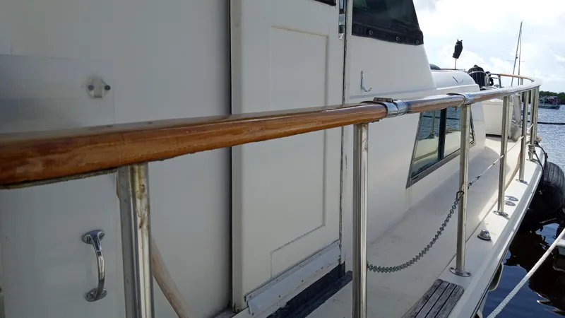 Slide: The Image of 1986 Hatteras 53 Extended Deckhouse Motor Yacht side deck with wooden handrail. - 21
