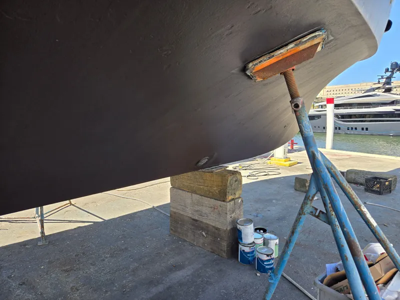 Slide: The Image of 1986 Hatteras 53 Extended Deckhouse yacht under maintenance, supported by stands and blocks. - 26