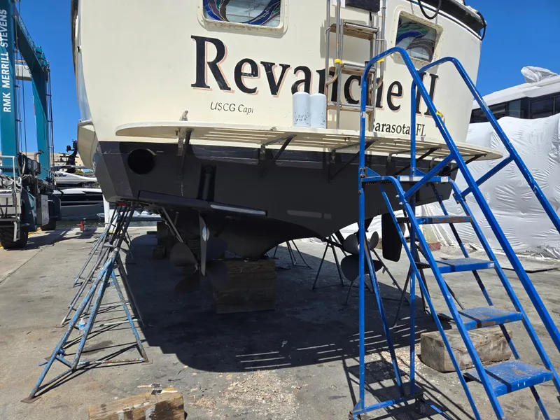 Slide: The Image of 1986 Hatteras 53 Extended Deckhouse yacht on dry dock with blue ladder, Sarasota, FL. - 42