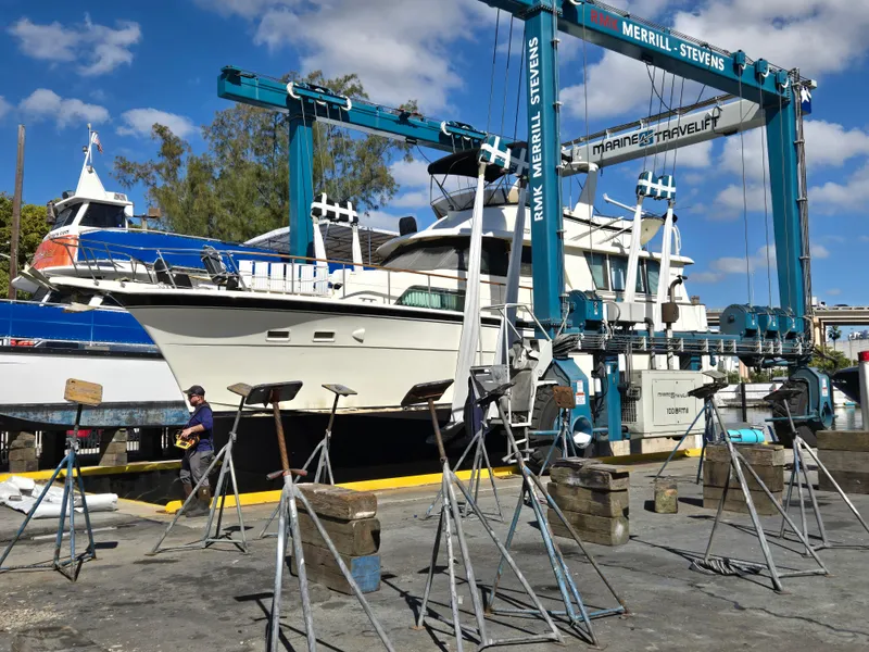Slide: The Image of 1986 Hatteras 53 Extended Deckhouse yacht in dry dock, undergoing maintenance. - 43