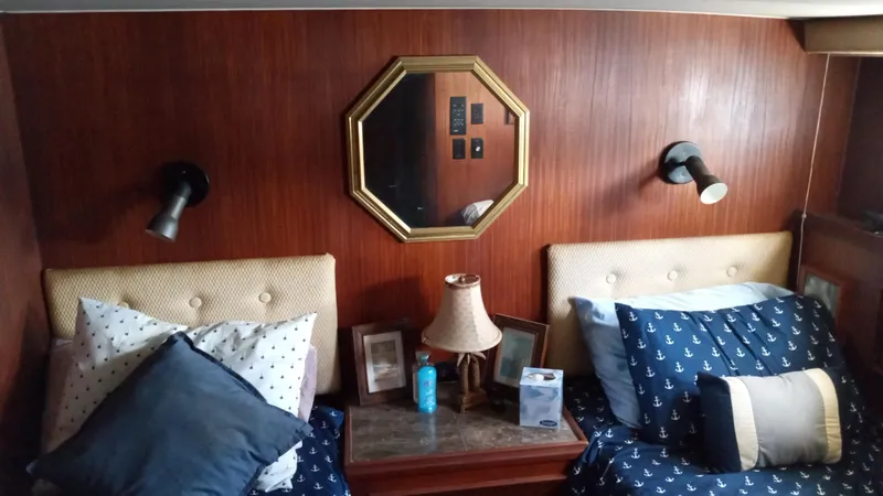 Slide: The Image of Interior cabin of 1986 Hatteras 53 Extended Deckhouse Motor Yacht with twin beds and nautical decor. - 5