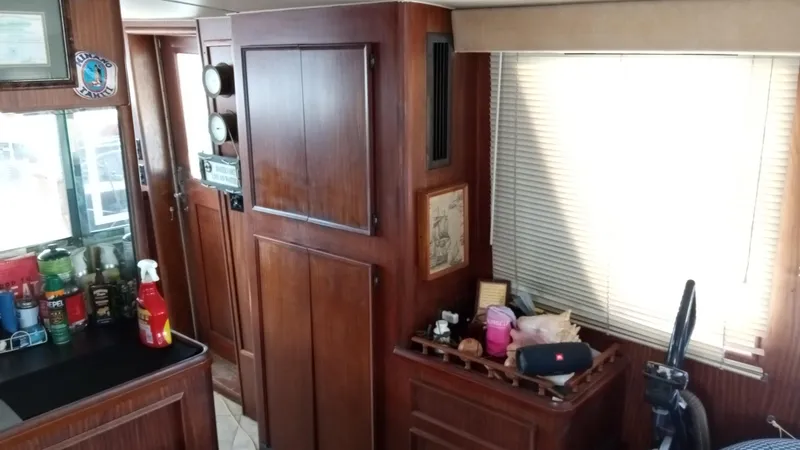 Slide: The Image of Interior of 1986 Hatteras 53 Extended Deckhouse Motor Yacht with wooden cabinetry. - 8