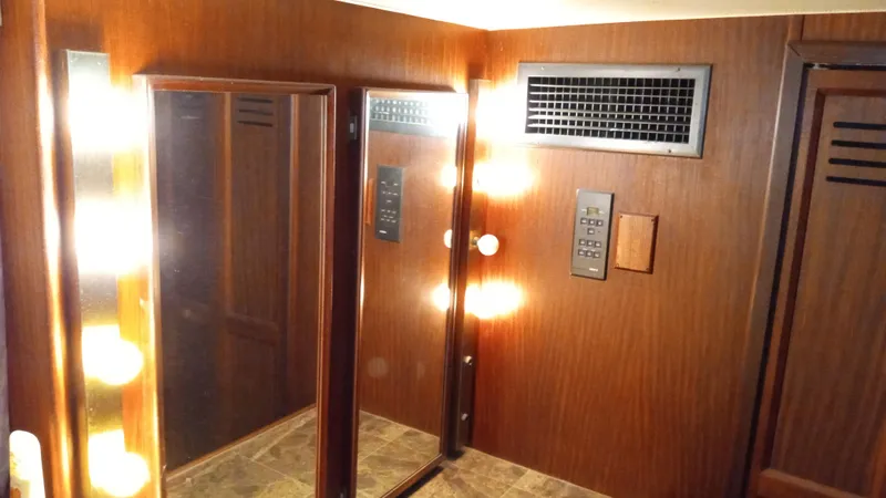 Slide: The Image of Interior of 1986 Hatteras 53 Extended Deckhouse Motor Yacht with wood paneling and mirrors. - 9
