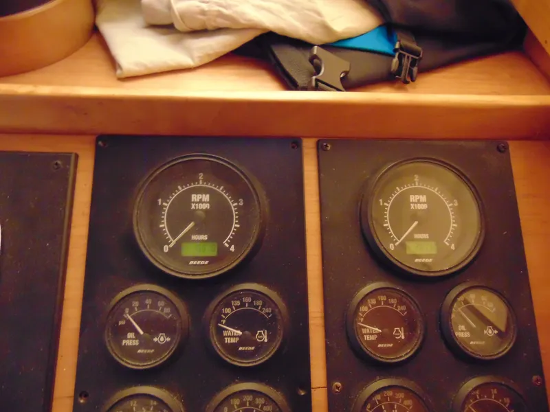 Slide: The Image of Instrument panel of a 2004 Sabre 36 Flybridge boat showing RPM and other gauges. - 17