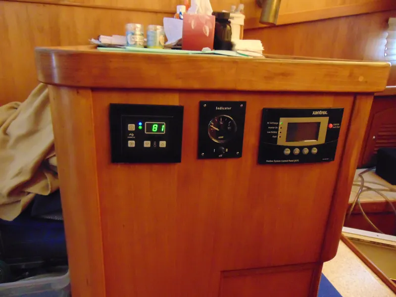 Slide: The Image of Control panel of a 2004 Sabre 36 Flybridge boat with various instruments. - 18