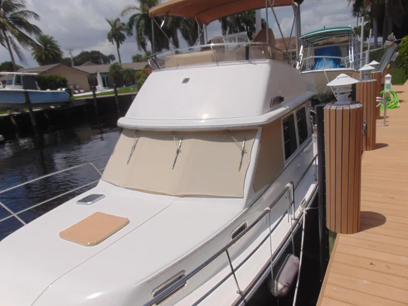 Slide: The Image of 2004 Sabre 36 Flybridge yacht docked at marina. - 4