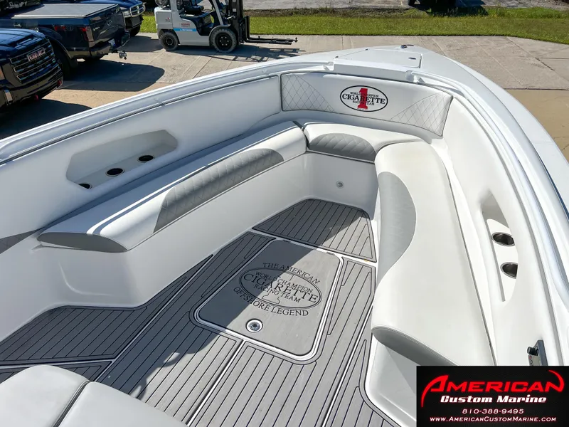 Slide: The Image of 2018 Cigarette 39 GTS boat interior with white and gray seating, American Custom Marine branding. - 21