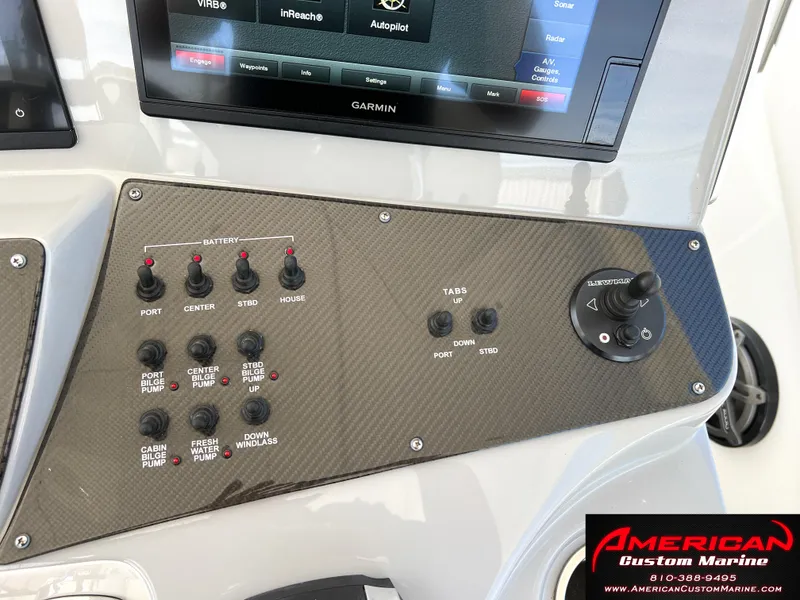 Slide: The Image of Control panel of 2018 Cigarette 39 GTS boat with Garmin display and switches. - 7
