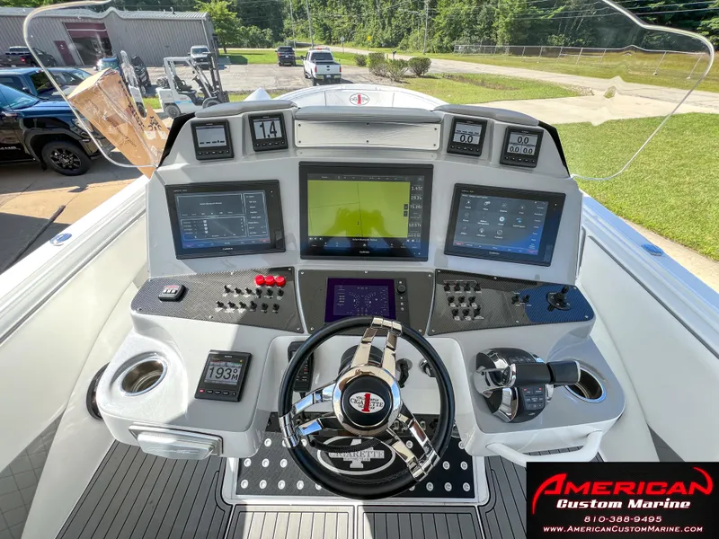Slide: The Image of 2018 Cigarette 39 GTS boat dashboard with advanced navigation and control systems. - 8