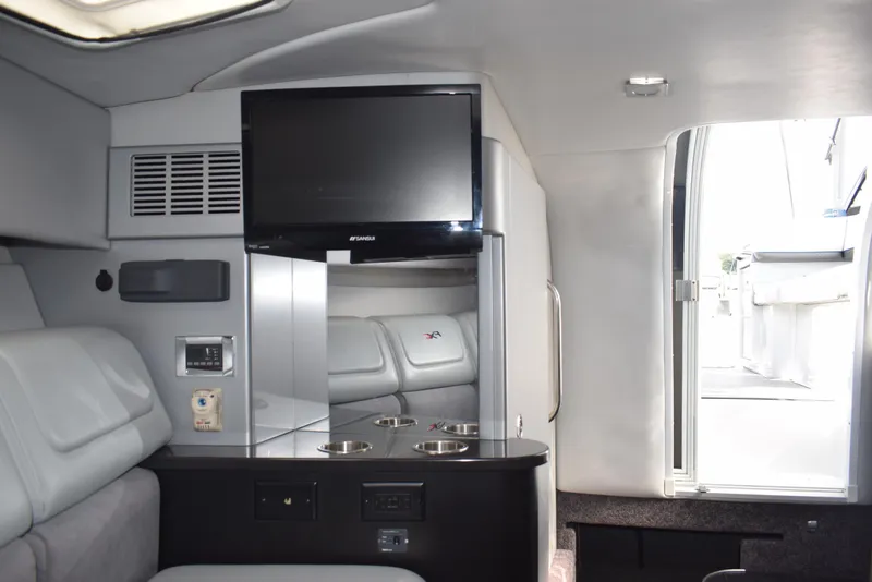 Slide: The Image of Interior of 2015 Formula 310 Sun Sport boat with TV and seating area. - 12