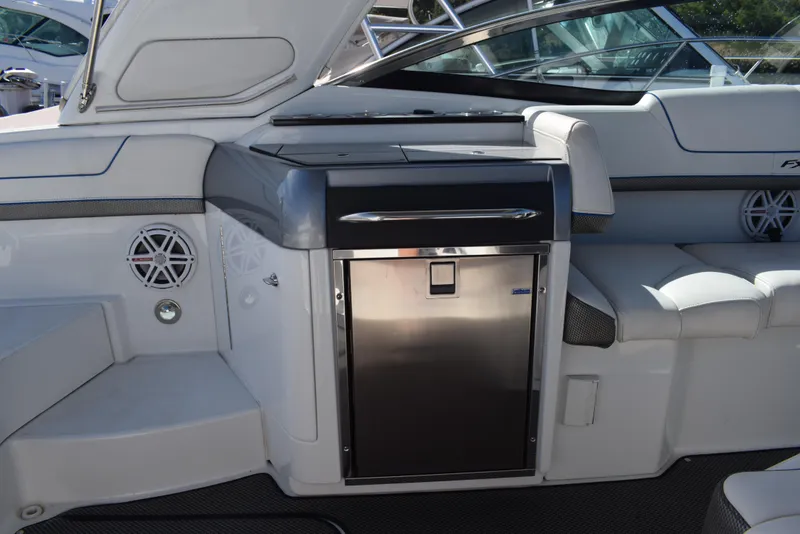 Slide: The Image of 2015 Formula 310 Sun Sport boat interior with stainless steel refrigerator. - 8