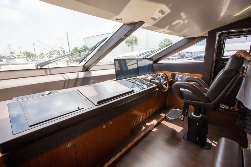 Slide: The Image of Luxurious helm of 2011 Princess 85 Motor Yacht with modern controls and panoramic windows. - 10