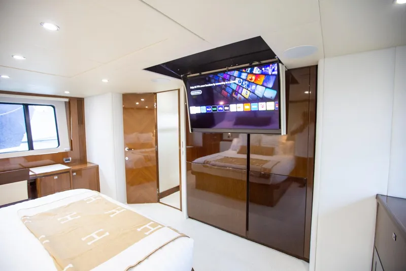 Slide: The Image of Luxurious bedroom in 2011 Princess 85 Motor Yacht with TV and elegant decor. - 14