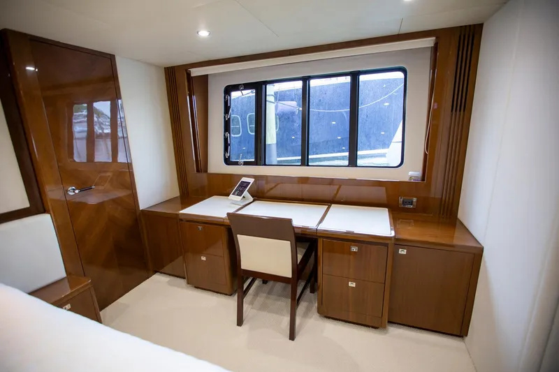 Slide: The Image of Luxurious office space on 2011 Princess 85 Motor Yacht with wooden desk and large window. - 16