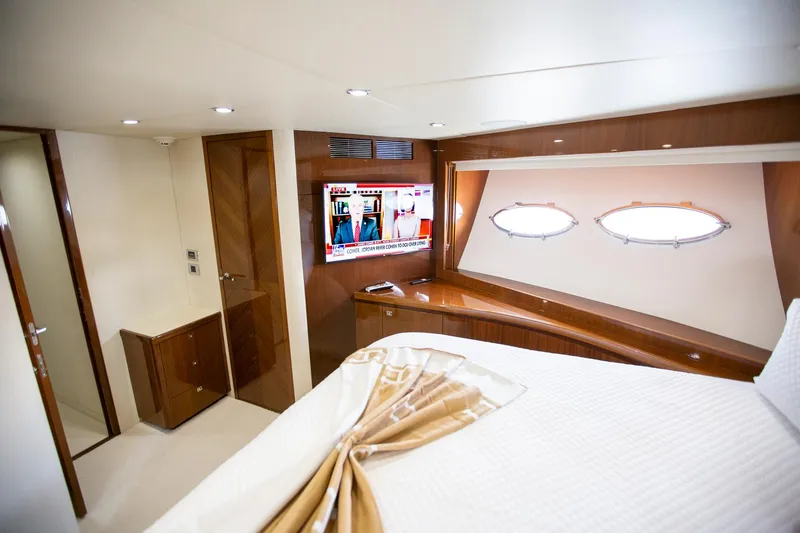 Slide: The Image of Luxurious cabin interior of 2011 Princess 85 Motor Yacht with TV and porthole windows. - 23