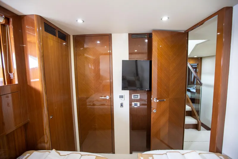 Slide: The Image of Luxurious interior of 2011 Princess 85 Motor Yacht with wood paneling and modern amenities. - 25