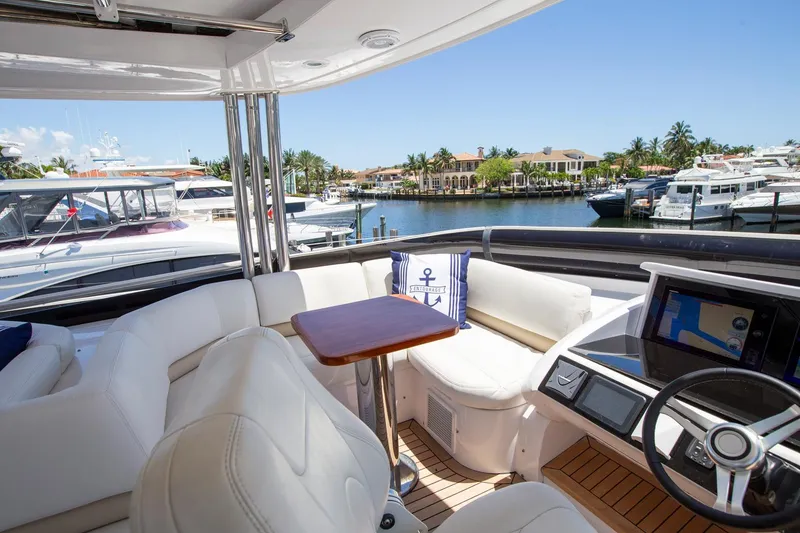 Slide: The Image of Luxurious 2011 Princess 85 Motor Yacht interior with plush seating and scenic marina view. - 32