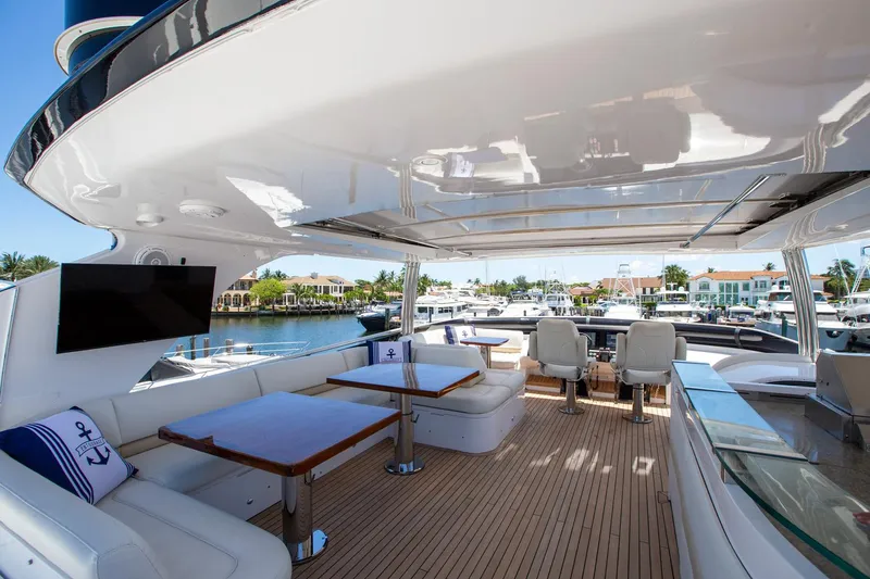 Slide: The Image of Luxurious 2011 Princess 85 Motor Yacht deck with seating, tables, and waterfront view. - 35