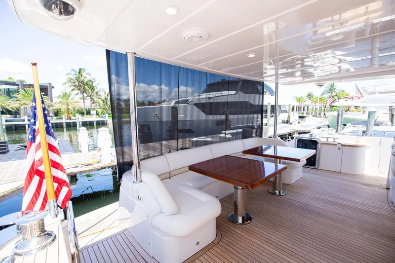 Slide: The Image of Luxurious 2011 Princess 85 Motor Yacht deck with seating and tables, docked at marina. - 48