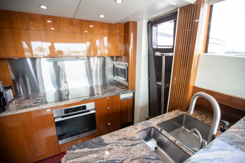 Slide: The Image of Luxurious kitchen in 2011 Princess 85 Motor Yacht with modern appliances and granite countertops. - 7