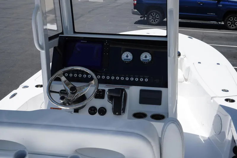 Slide: The Image of 2025 Blazer 2550 GTS boat dashboard with steering wheel and control panel. - 11