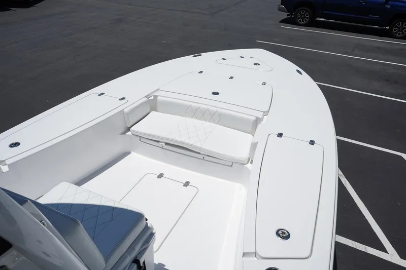 Slide: The Image of 2025 Blazer 2550 GTS boat bow seating and storage compartments. - 14